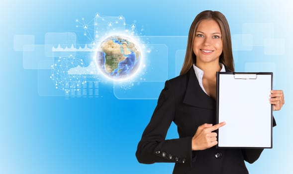 Beautiful businesswoman in suit holding paper holder. Earth, network and graphs in background. Elements of this image furnished by NASA