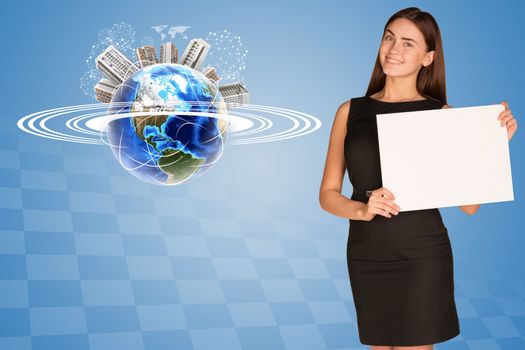 Beautiful businesswoman in dress holding paper holder. Earth with buildings and orbit in background. Elements of this image furnished by NASA