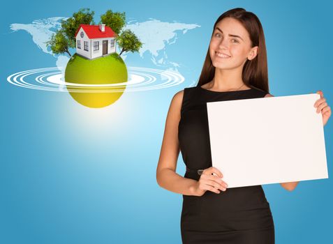 Beautiful businesswoman in dress holding paper holder. Earth with house and trees in background