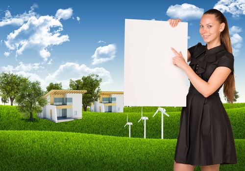 Businesswoman holding empty paper. House and nature landscape as backdrop