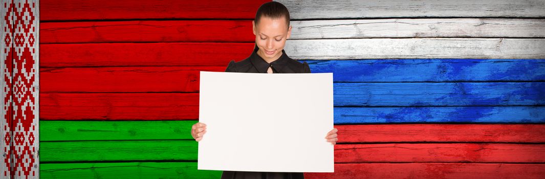 Businesswoman holding paper sheet. Byelorussia and Russia flags as backdrop