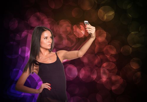 Beautiful dancer makes selfie from your mobile phone. Abstract background