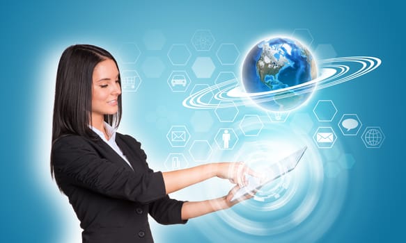 Beautiful businesswomen in suit using digital tablet. Earth and hexagons with icons. Element of this image furnished by NASA