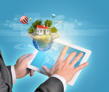 Man hands using tablet pc. Earth with buildings and trees near tablet. Element of this image furnished by NASA
