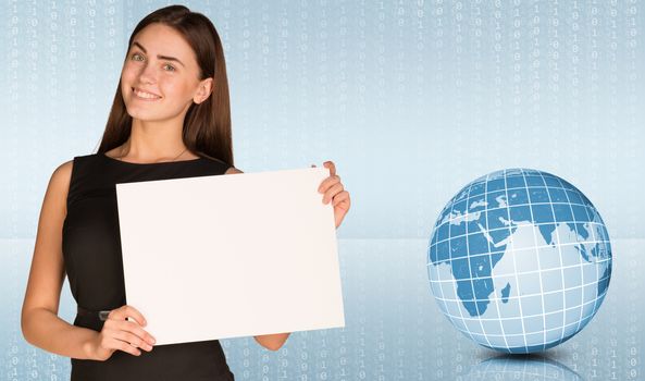 Businesswoman hold paper sheet. Earth and graphs as backdrop. Elements of this image furnished by NASA