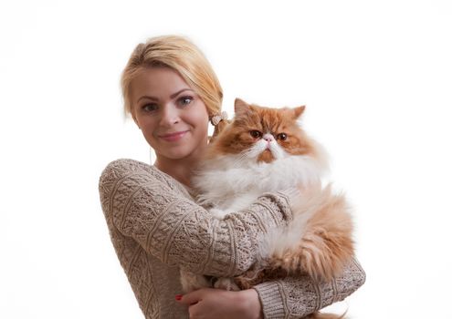 The young nice girl holds a red Persian cat on hands