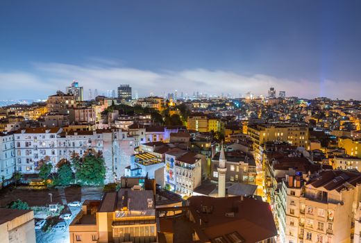ISTANBUL - SEPTEMBER 17, 2014: City night panorama. Istanbul is visited by more than 11 million people every year.