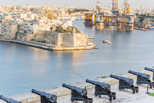 The old gun in La Valletta and Fort St. Angelo of La Vittoriosa in Malta