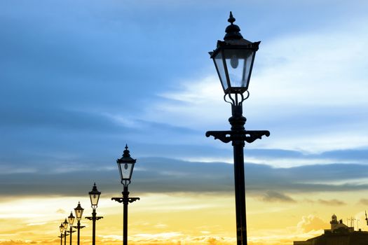 lighthouse and row of vintage lamps on the promenade in Youghal county Cork Ireland