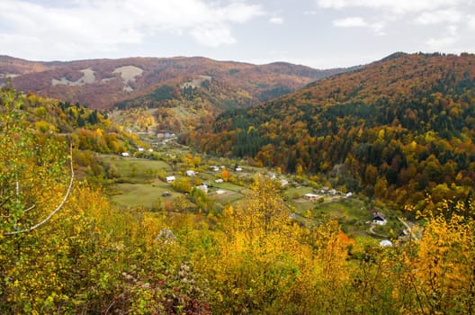 Colorful autumn landscape in a mountain village.