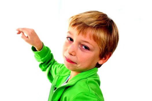 A young boy in studio in green cardigan on white background