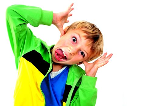 A young boy in studio in green cardigan on white background