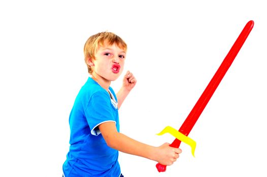 A young boy playing with sword on a white background