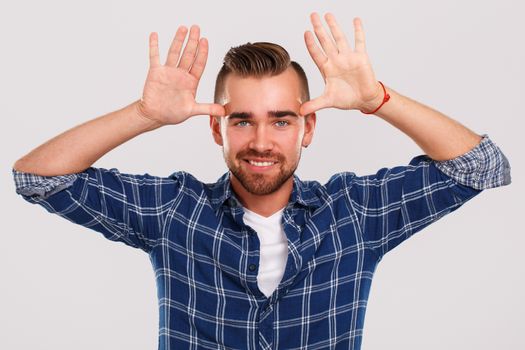 Emotions, feelings. Young guy with on a white background