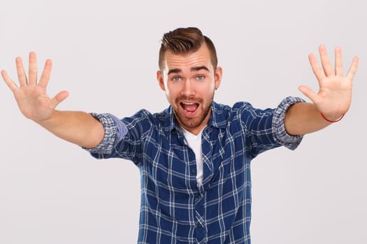 Emotions, feelings. Young guy with on a white background