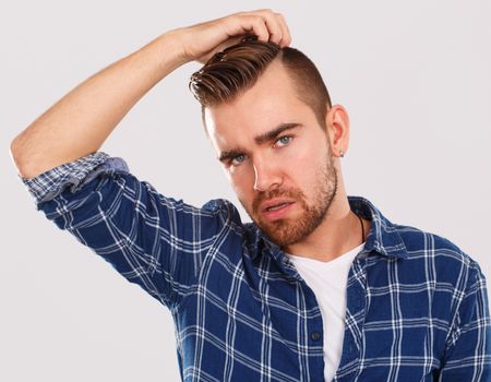 Emotions, feelings. Young guy with on a white background