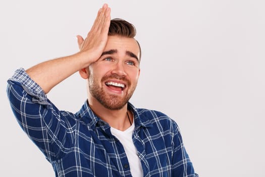 Emotions, feelings. Young guy with on a white background