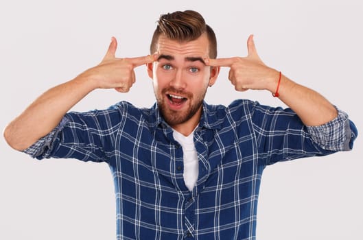 Emotions, feelings. Young guy with on a white background