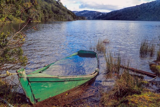 Picturesque view of a boat sinking into a lake               