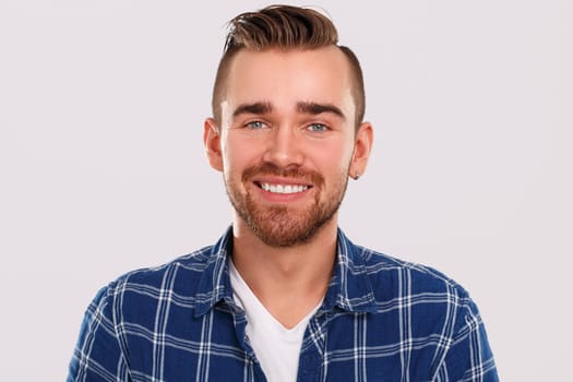 Emotions, feelings. Young guy with on a white background