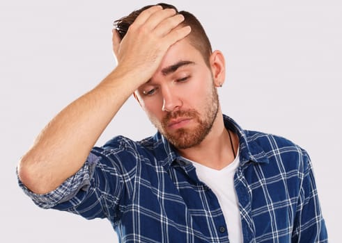 Emotions, feelings. Young guy with on a white background