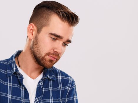 Emotions, feelings. Young guy with on a white background