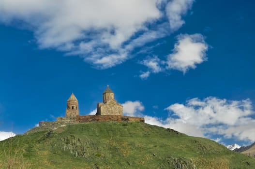 Panoramic view of an old Georgian church standing on a hill 