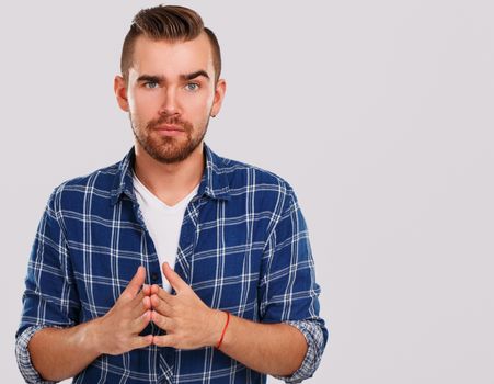 Emotions, feelings. Young guy with on a white background