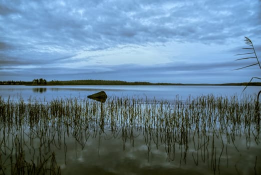Panoramic view of sky reflected on the surface of a lake in Finland