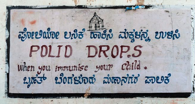 Street sign in Bengaluru, India, partly written in Kannada and English.