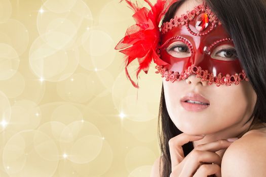 Portrait of Asian young beautiful woman in a carnival mask, closeup portrait.