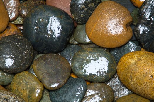 Pile of round peeble stones for background