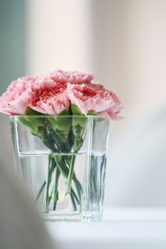 Bouquet of carnation flowers in glass vase