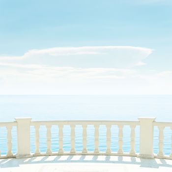 balcony over sea and light clouds in blue sky
