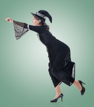 Asian witch riding something, full length portrait isolated.