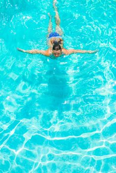 active athlete swims in the pool