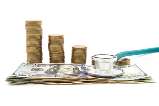 Stack of coins and money and stethoscope