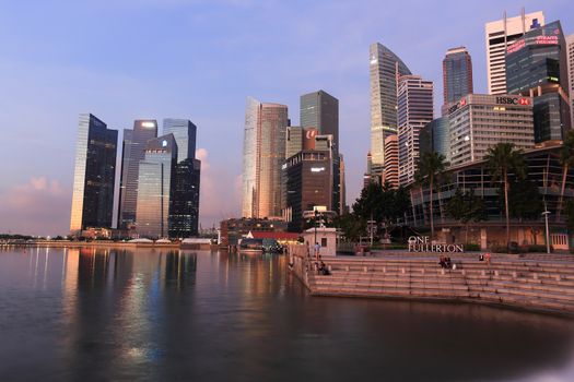 SINGAPORE - May 10: The Merlion fountain in front of the Marina Bay Sands hotel on May 10, 2014 in Singapore. Merlion is a imaginary creature with the head of a lion, seen as a symbol of Singapore