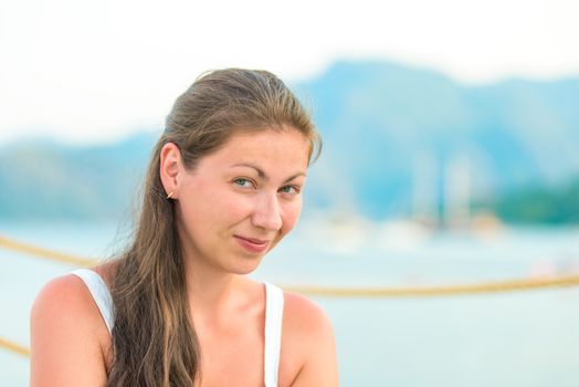 playful look of a girl in a white T-shirt