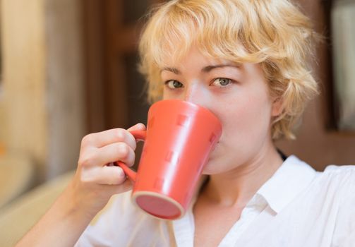 Casual Dressed Beauty Girl With Cup of Coffee.