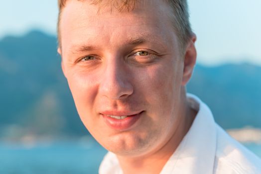 close-up portrait of a handsome man outdoors