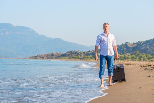 stroll along the sandy beach with luggage