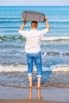 man with a suitcase goes to sea