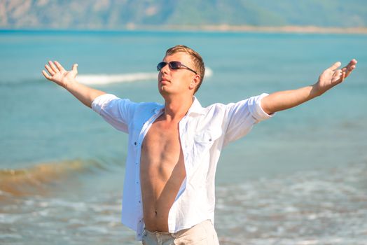 handsome man in the resort enjoys the freedom