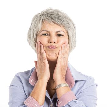 Portrait of a elderly woman making a funny face 