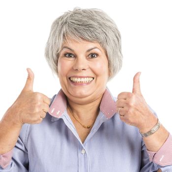 Portrait of a elderly woman with thumbs up