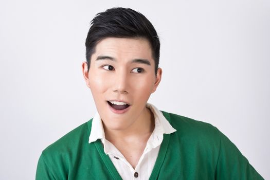 Funny facial expression, closeup Asian young man.