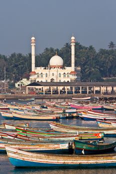 fishing harbour with mosque in the background (Arabian Sea, Kerala, India)