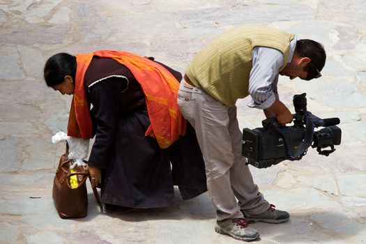 Hemis, Ladakh, INDIA - JUN 29: Believer and operator at mask dance festival in Hemis monastery on Jun 29, 2012 in Hemis, Ladakh, India.