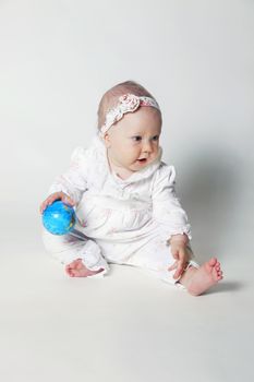 Beautiful small kid girl in studio